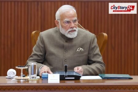 Defence Minister congratulates PM Modi on completing 25 years in public service