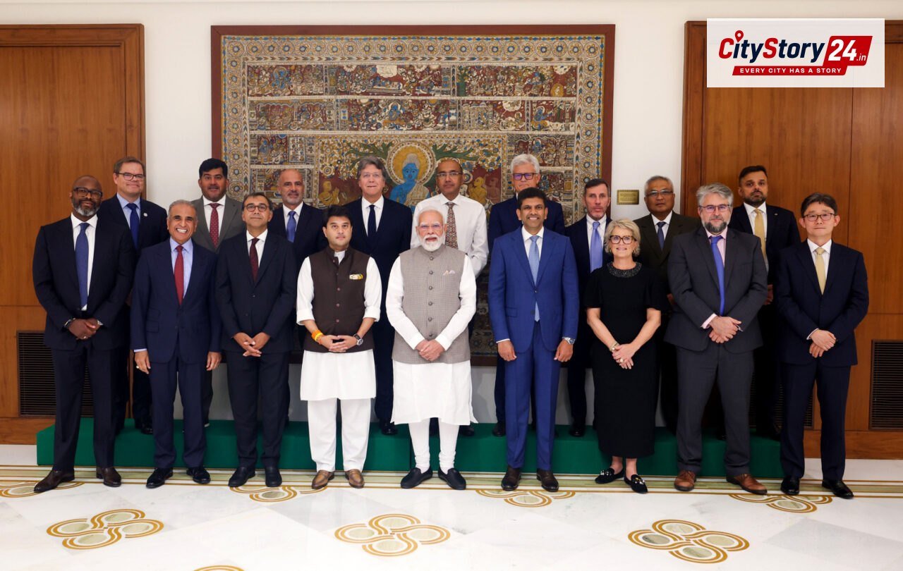 PM in a group photograph with Global System for Mobile Communications Association (GSMA) Board members at Seva Teerth, in New Delhi on October 06, 2026.