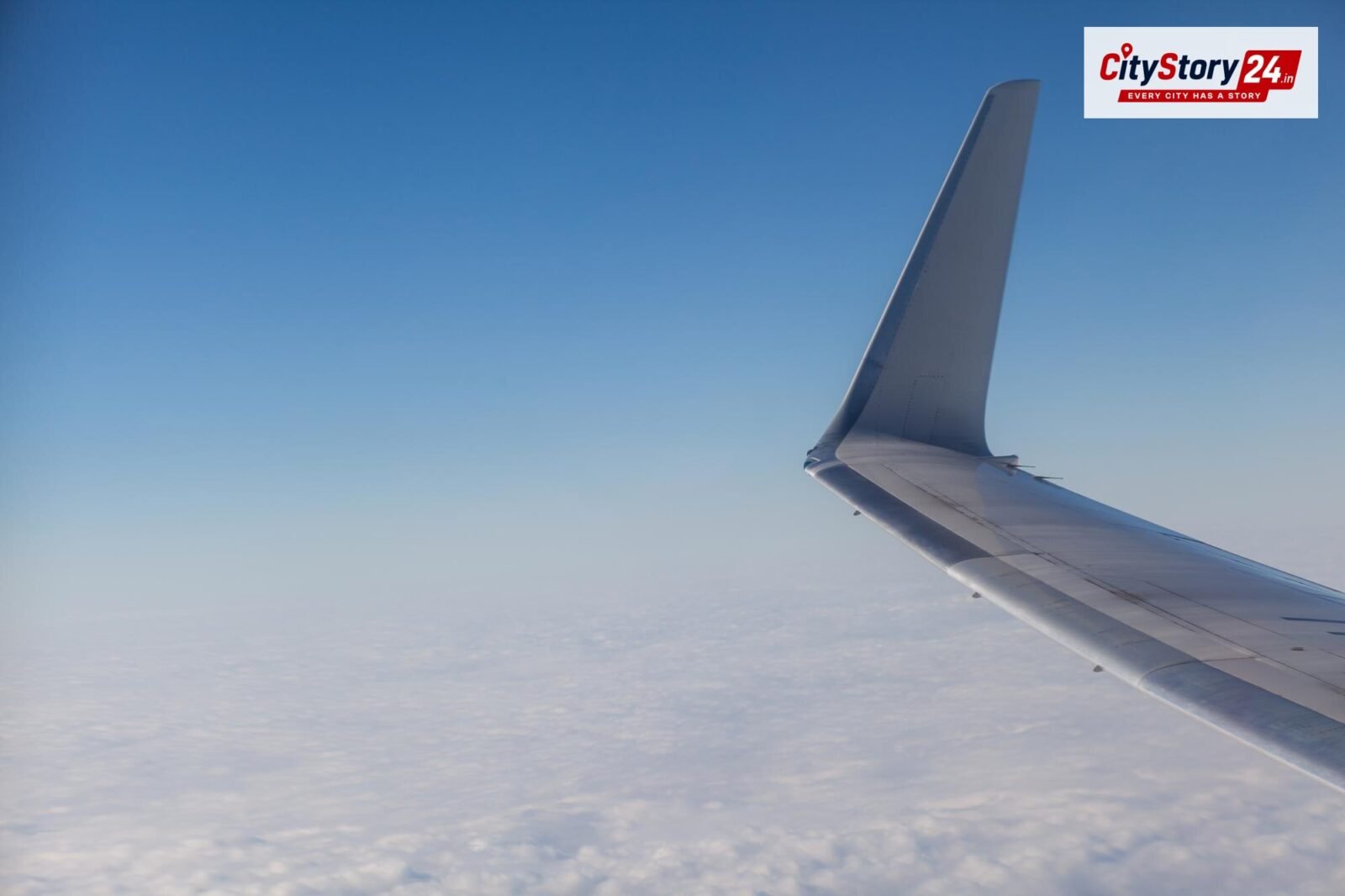 Representative image: passenger airplane wing sky